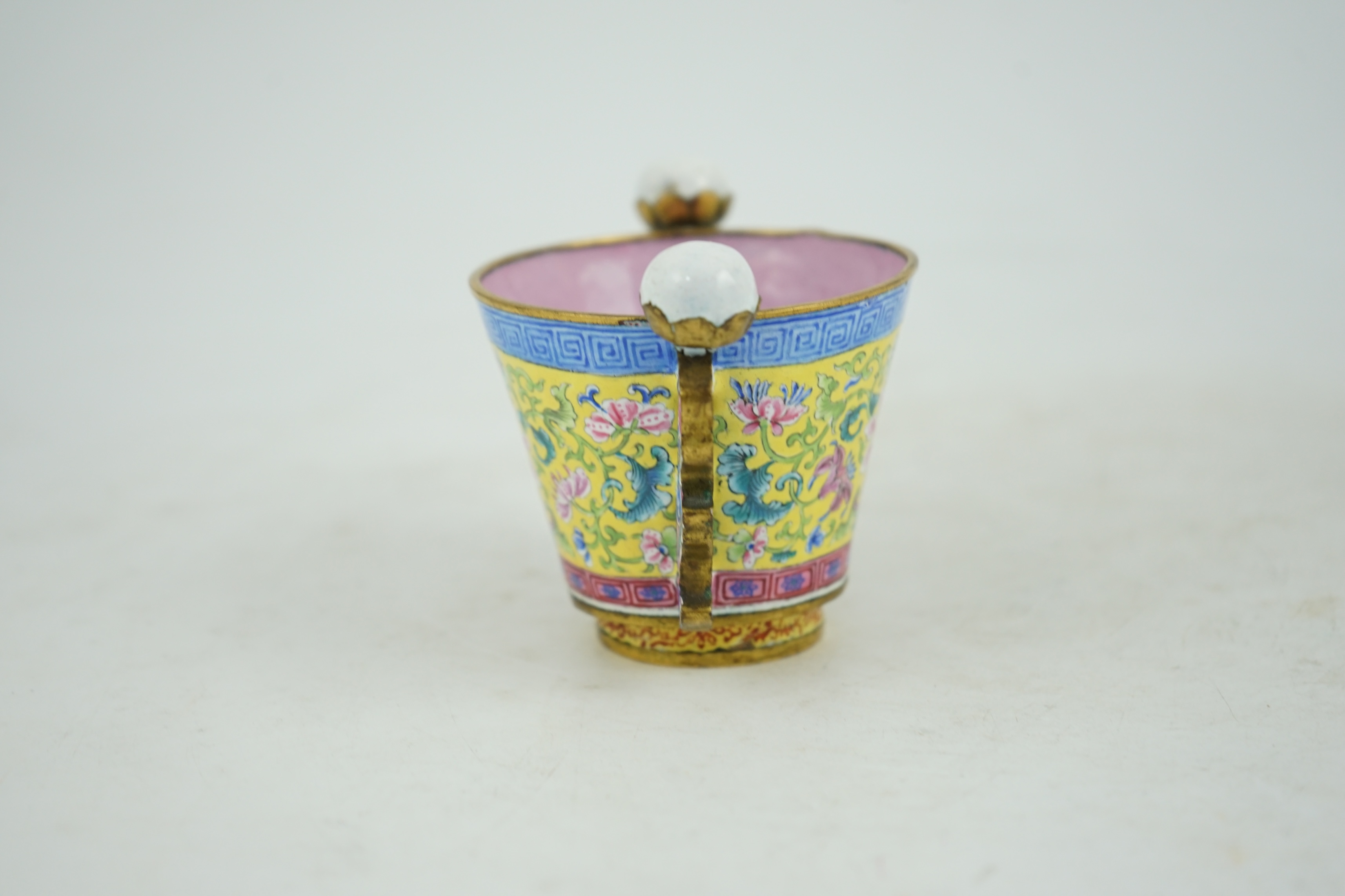 A Chinese Guangzhou enamel two handled wine cup, four character Qianlong mark and of the period (1736-1795)